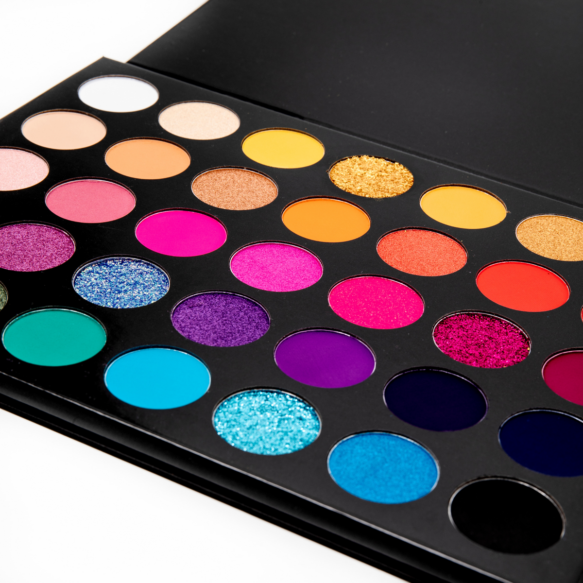 Weekend Fetish Makeup palette with a variety of colorful eyeshadows on a white background